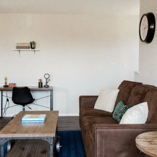 Leather couch opens up into a sofa bed for more guests.