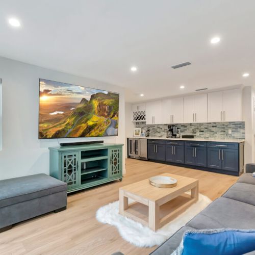Family room with kitchenette/bar and acess to the patio.