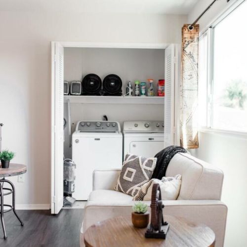Washer and dryer in unit, located in the living room.