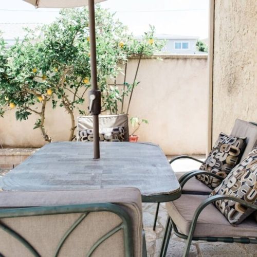 Patio seating behind unit. Feel free to pick the lemons!