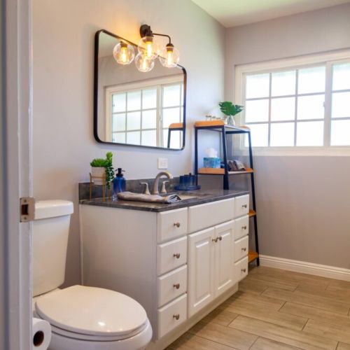 Large master bathroom with bathtub, large walk-in shower and plenty of natural light.