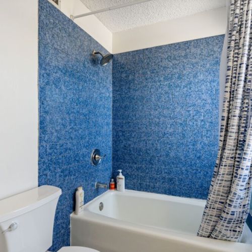 Full bathroom with a bathtub down the hall to the left.