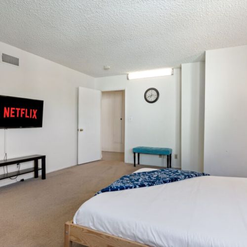Bedroom views with a peek into the hallway.