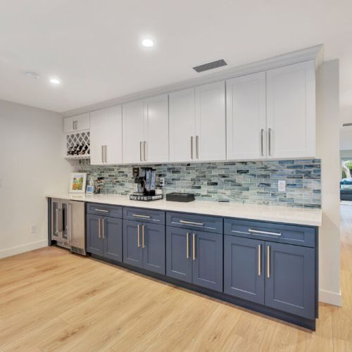 View of the kitchennette/bar. Hallway to the left leading to bedrooms.