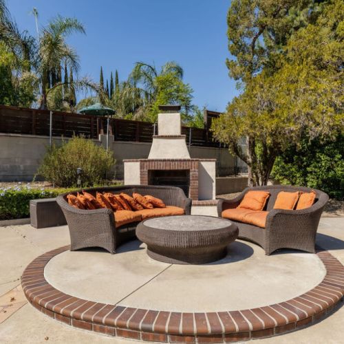 Outdoor seating and wood fireplace