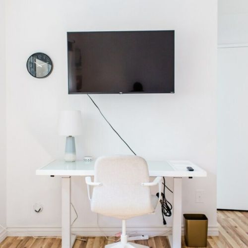 4K Roku Smart TV and work desk in master bedroom