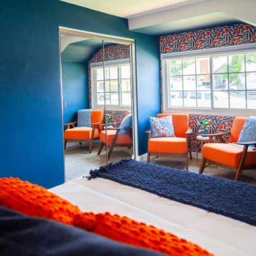 California Poppy Room is full of color. Designed with the California coast in mind and furnished with a King size bed, plenty of natural light or black out curtains. This room has a seating area for reading, plenty of storage and 40 in Roku TV.