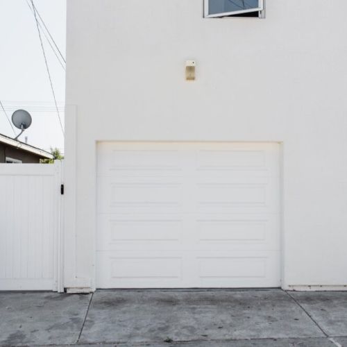 One parking spot provided behind the back house.