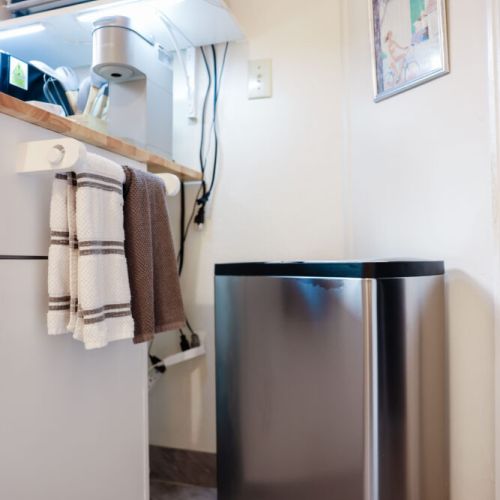 Full sized trash can. It's the thoughtful commodities that make a home feel like a home. :)