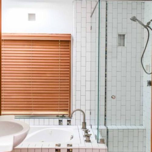 Master bath has both a shower and bathtub.