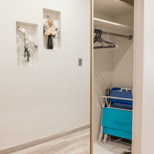 Entryway closet with beach chairs