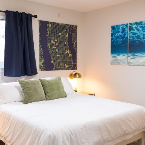 Third bedroom furnished with a king-sized bed