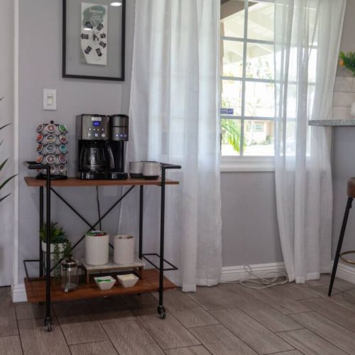 The dining room and kitchen have big windows to view the front yard and people walking to the Anaheim Convention Center.