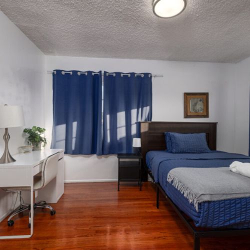 Fifth bedroom equipped with a twin-size bed and desk