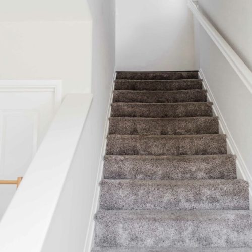 One bedroom on ground level, and the stairs lead to the rest of the home.
