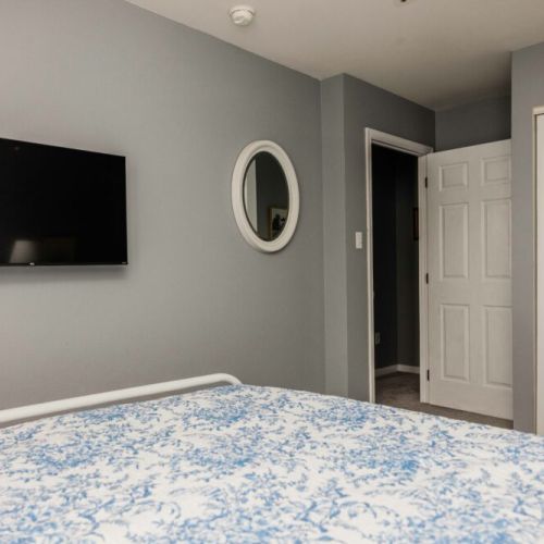 Master bedroom has full-sized closet and 4K TV