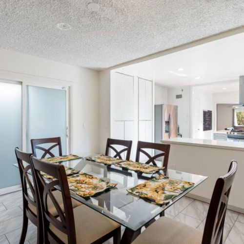 Enjoy this open dining + kitchen area. Convenient to serve the table and never miss out on a conversation!