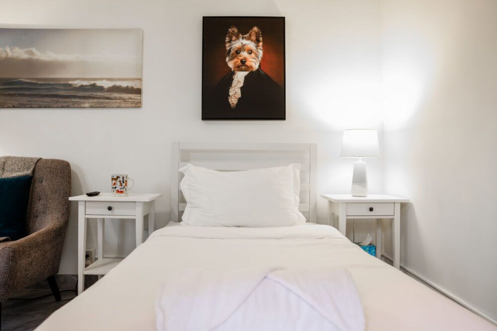 "Bedroom" furnished with two nightstands and a dresser