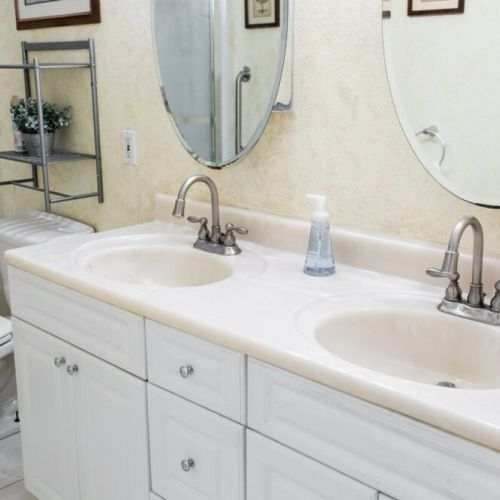 Shared full bathroom with double sinks