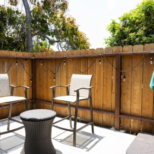 Front patio connected to the living room. Turn on the string of lights for a beautiful evening vibe.