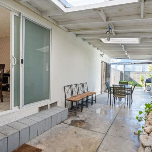 The dining room opens up into a spacious covered outdoor patio. This is perfection on a hot sunny day!