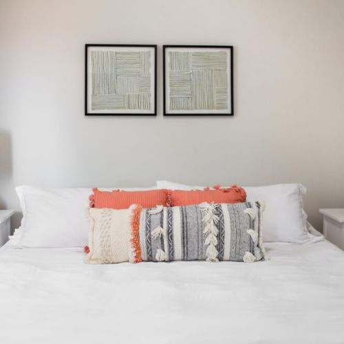 Second bedroom furnished with  spacious nightstands