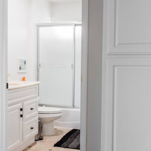 Second bathroom off the hallway. Cabinets in the hallway have extra linens.