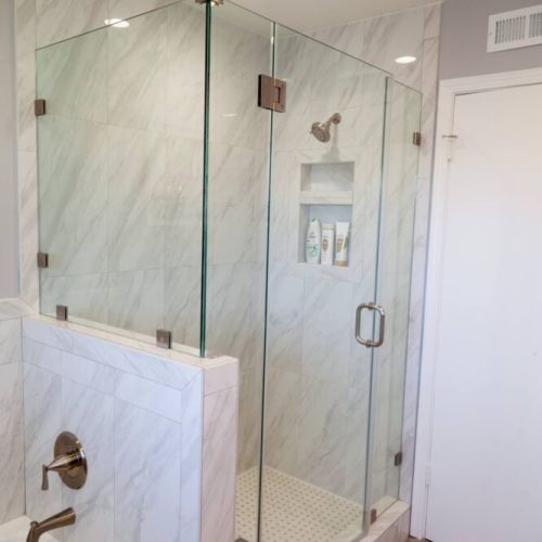 Large master bathroom with bathtub and large walk-in shower.