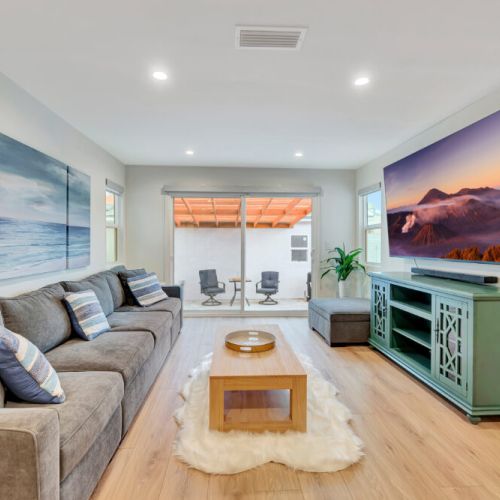 Family room with the biggest TV you're ever see