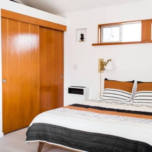 Second bedroom with closet and shelving.