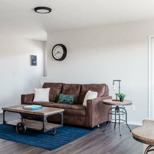 View of living room with laundry doors closed.