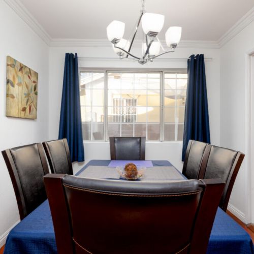 Gather around the dining table with easy access to the kitchen.