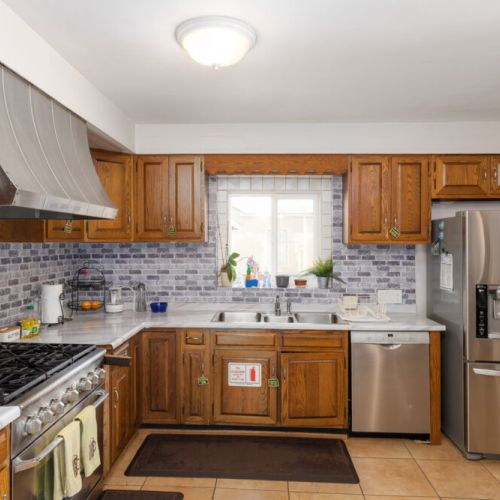 Fully stocked kitchen with stainless steel appliances and cooking essentials!