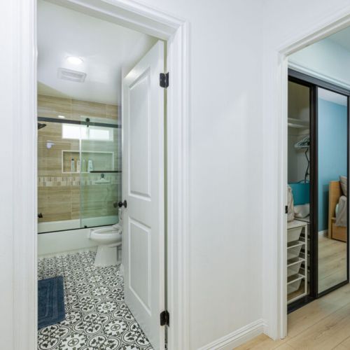 Hall view of guest bathroom and master bedroom