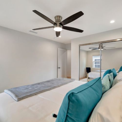 Second bedroom with ceiling fan and full-sized closet