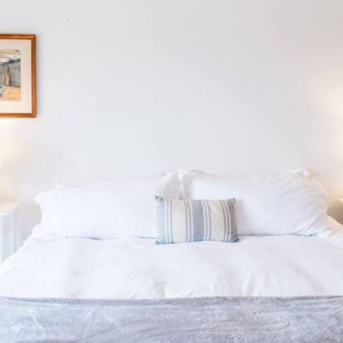 1st bedroom - Every bedroom has a king bed and nightstand lamps.