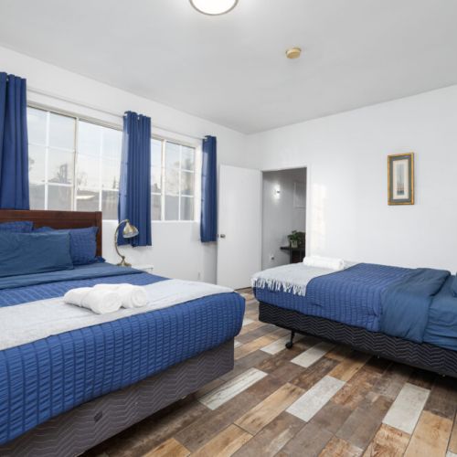 Large master bedroom with two queen beds