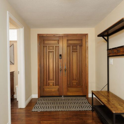 Front entry way, half bathroom to the left