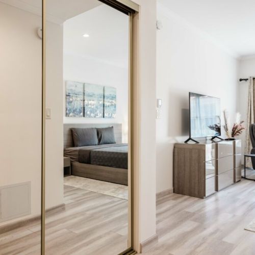You won't run out of space to store your belongings with a mirrored closet and large dresser.