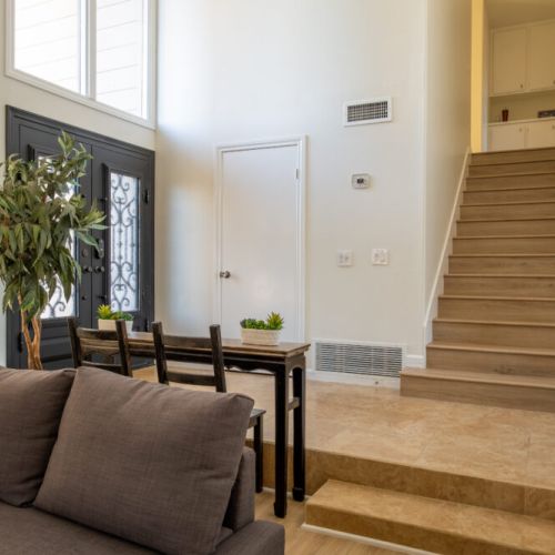 Entry way + stairs leading to bedrooms