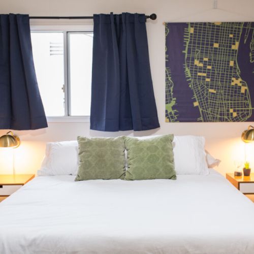 Queen bed and lamps for cozy bed time reading