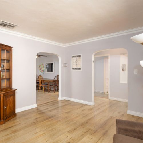 Family room peeking into the dining area and hallway to the bedrooms
