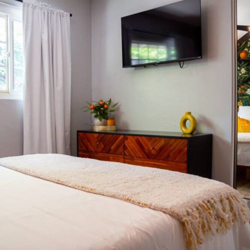 Orange Blossom Room is beautifully designed with a queen bed memory foam mattress, great natural light and black out curtains. This room is ready for a restful night sleep after a busy day or night of work or entertainment. Includes 40 in Roku TV.