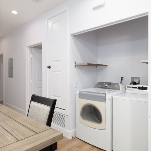 Washer/dryer located in the hallway