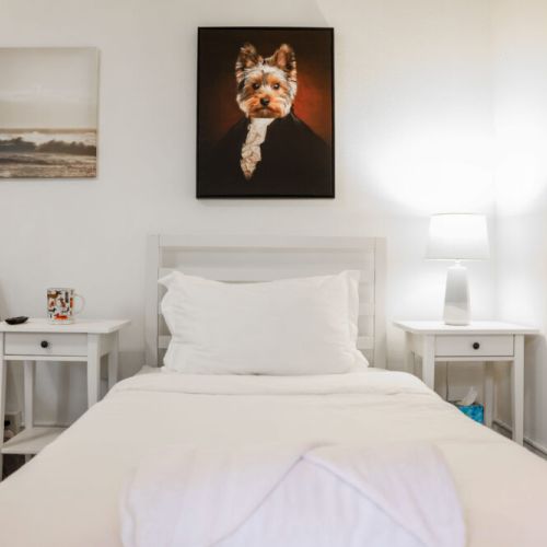 "Bedroom" furnished with two nightstands and a dresser