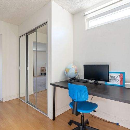 Having two desks in this large bedroom makes it easy for students, remote workers, or young professionals to have their own space to focus.